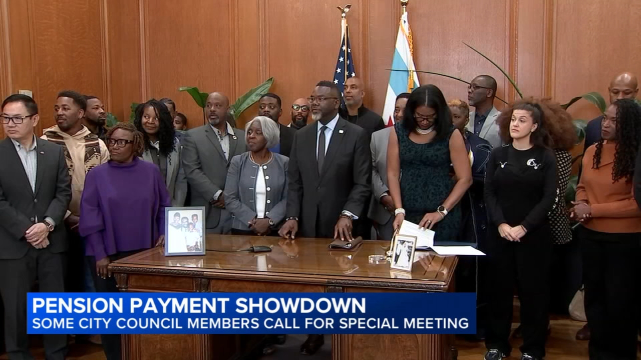 Chicago City Council chambers with Mayor Brandon Johnson at the podium during a budget debate